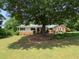 Ranch style home nestled amongst mature trees at 114 Tracy Ln, Mcdonough, GA 30253