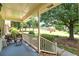 Spacious front porch with seating and view of yard at 114 Tracy Ln, Mcdonough, GA 30253