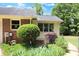 Brick house side view with well-manicured landscaping at 114 Tracy Ln, Mcdonough, GA 30253