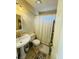 Clean bathroom with pedestal sink, shower, and toilet at 2919 Riverwalk Cv, Decatur, GA 30034