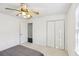 Spacious bedroom with double door closet and ceiling fan at 3007 Winding Sw Way, Lilburn, GA 30047