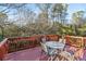 Wooden deck with table and chairs overlooking the backyard at 3007 Winding Sw Way, Lilburn, GA 30047