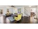 Living room with hardwood floors, gray sofas, and a yellow accent chair at 3007 Winding Sw Way, Lilburn, GA 30047