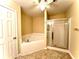 Bathroom with corner soaking tub and separate shower stall at 307 Creek Manor Way, Suwanee, GA 30024