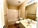 Small bathroom with a single vanity, toilet, and shower/tub combo at 307 Creek Manor Way, Suwanee, GA 30024