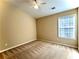 Bright bedroom with carpeted floor and a window with blinds at 307 Creek Manor Way, Suwanee, GA 30024