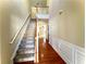 Two-story entryway with hardwood floors and a staircase at 307 Creek Manor Way, Suwanee, GA 30024