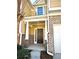 Inviting front entrance with brick accents and a charming covered porch at 307 Creek Manor Way, Suwanee, GA 30024