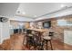 Finished basement bar area with rustic wood table and brick wall at 3998 St Georges Ct, Duluth, GA 30096