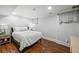 Comfortable basement bedroom with a king-size bed and wood floors at 3998 St Georges Ct, Duluth, GA 30096