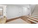 Finished basement hallway with hardwood floors and ample storage at 3998 St Georges Ct, Duluth, GA 30096