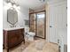 Elegant bathroom with vanity, toilet, and a large walk-in shower at 3998 St Georges Ct, Duluth, GA 30096