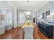 Elegant dining room featuring hardwood floors, a statement chandelier, and a built-in buffet at 3998 St Georges Ct, Duluth, GA 30096