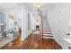 Grand entryway with hardwood floors, white columns, and a view of the staircase at 3998 St Georges Ct, Duluth, GA 30096