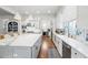 Spacious kitchen featuring a large island, stainless steel appliances, and white cabinetry at 3998 St Georges Ct, Duluth, GA 30096