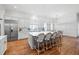 Modern kitchen with white cabinets, large island, and stainless steel appliances at 3998 St Georges Ct, Duluth, GA 30096