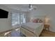 Bright bedroom with a queen-size bed and wood flooring at 6320 Glen Oaks Ln, Sandy Springs, GA 30328