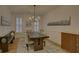 Formal dining room with wood floors and a chandelier at 6320 Glen Oaks Ln, Sandy Springs, GA 30328