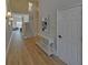 Light-filled entryway with hardwood floors and elegant console table at 6320 Glen Oaks Ln, Sandy Springs, GA 30328