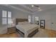 Spacious main bedroom with hardwood floors and a ceiling fan at 6320 Glen Oaks Ln, Sandy Springs, GA 30328