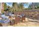 Relaxing stone patio with seating area and hot tub at 6320 Glen Oaks Ln, Sandy Springs, GA 30328