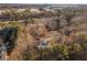 Aerial view of house nestled in wooded area, close to Historic Downtown Norcross at 820 Oak Ter, Norcross, GA 30071