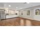 Basement kitchenette with white cabinets and stainless steel appliances at 820 Oak Ter, Norcross, GA 30071