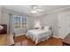 Bedroom with hardwood floors and a white bedspread at 820 Oak Ter, Norcross, GA 30071