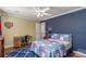 Bedroom with a blue and red quilt and hardwood floors at 820 Oak Ter, Norcross, GA 30071