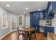 Charming breakfast area with a round wooden table and built in blue cabinetry at 820 Oak Ter, Norcross, GA 30071