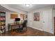 Basement home office with built-in bookcase and wood desk at 820 Oak Ter, Norcross, GA 30071