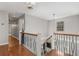 Upper hallway with hardwood floors and elegant railing at 820 Oak Ter, Norcross, GA 30071