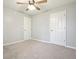 Simple bedroom with two closets and ceiling fan at 15 Indian Woods Ne Dr, Rydal, GA 30171