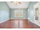 Hardwood floors and vaulted ceiling in this serene bedroom with ensuite bath at 15 Indian Woods Ne Dr, Rydal, GA 30171