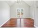 Dining room with hardwood floors and French doors leading to a deck at 15 Indian Woods Ne Dr, Rydal, GA 30171