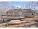 Back exterior view showing a two-story home with a deck at 15 Indian Woods Ne Dr, Rydal, GA 30171