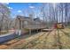 Back of house showing deck and backyard at 15 Indian Woods Ne Dr, Rydal, GA 30171