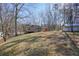 Home's exterior with large backyard and shed at 15 Indian Woods Ne Dr, Rydal, GA 30171