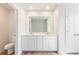 Double vanity bathroom with toilet and linen closet at 1946 Westwind Street (Lot 132), Lawrenceville, GA 30043