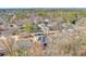 Aerial view showcasing home's setting and city skyline at 2465 Henderson Rd, Tucker, GA 30084