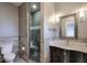 Modern bathroom with glass shower and dark vanity at 2465 Henderson Rd, Tucker, GA 30084