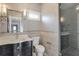 Modern bathroom with glass shower and dark vanity at 2465 Henderson Rd, Tucker, GA 30084