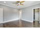 Bright bedroom featuring hardwood floors and a large closet at 2465 Henderson Rd, Tucker, GA 30084