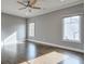 Bright bedroom with hardwood floors and large windows at 2465 Henderson Rd, Tucker, GA 30084