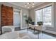 Home office featuring a white desk and sliding barn door at 2465 Henderson Rd, Tucker, GA 30084