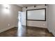 Home theater room with projector screen and hardwood floors at 2465 Henderson Rd, Tucker, GA 30084