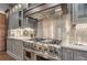 Modern kitchen with stainless steel appliances and gray cabinets at 2465 Henderson Rd, Tucker, GA 30084