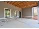 Covered patio with concrete flooring and exterior access at 2465 Henderson Rd, Tucker, GA 30084