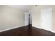 Bright bedroom with hardwood floors and access to bathroom at 1598 Blue Spruce Ln, Conyers, GA 30012