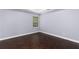 Bedroom with hardwood floors and neutral-colored walls at 1598 Blue Spruce Ln, Conyers, GA 30012